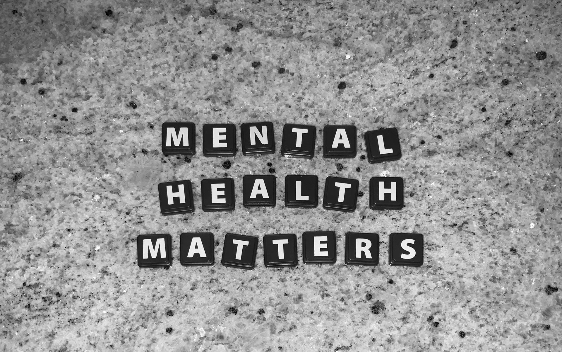 scrabble pieces on the floor spelling out mental health matters