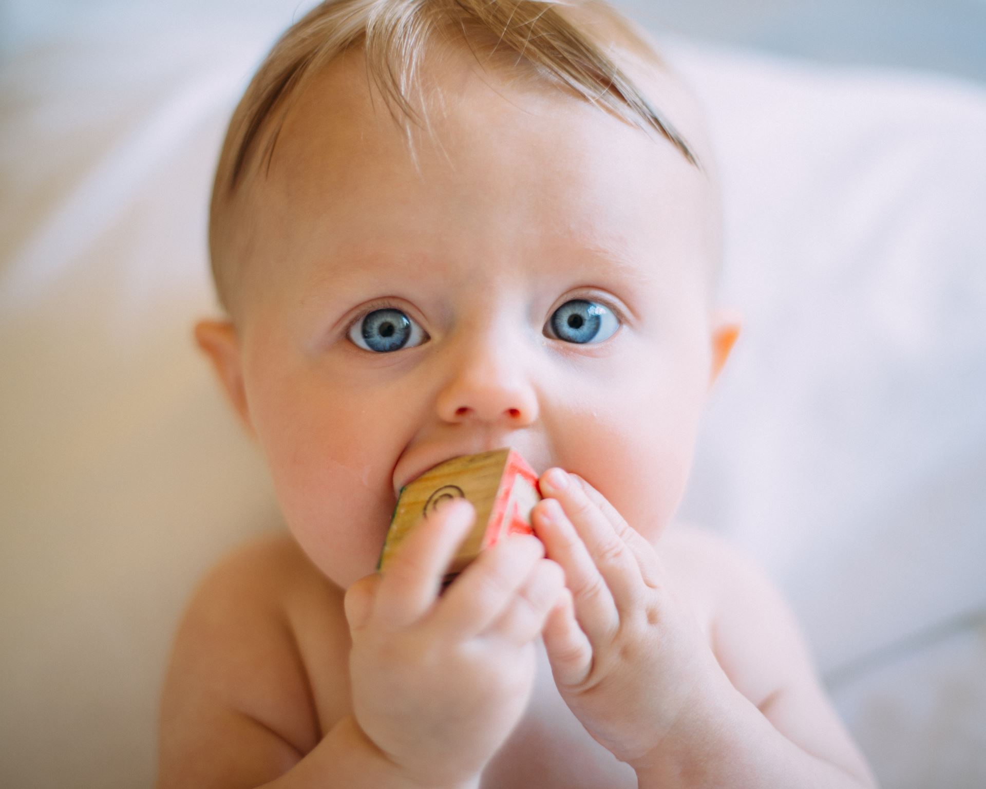 a young boy eating a banana